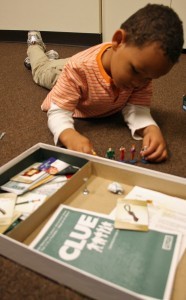 boy playing clue