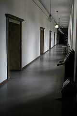 Hallway of school with doors by Wrote