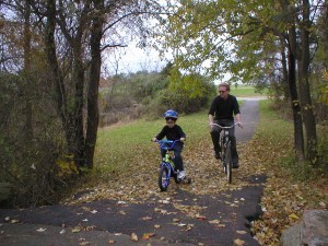 Charlie & Jim riding bikes in 2002 by kristina chew