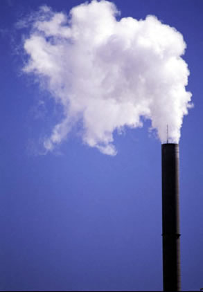 Smokestack against blue sky