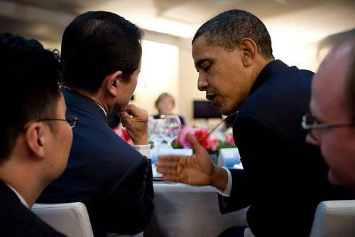 President Barack Obama confers with Japanese Prime Minister Taro Aso at the G-8 summit in L\'Aquila, Italy, July 8, 2009. Official White House Photo by Pete Souza