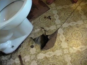 toilet-floor hole in floor by toilet