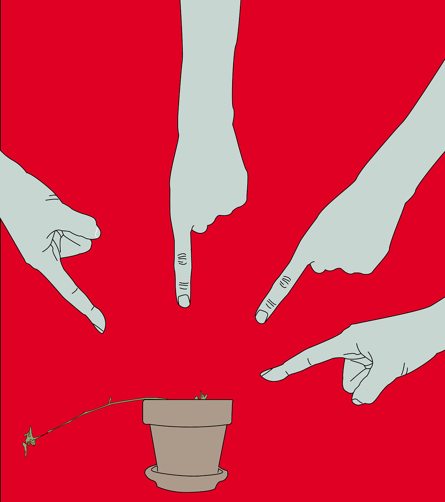 four white hands on a red field point at a dying plant