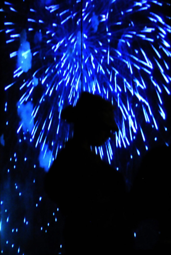Fireworks in the backgroud on a female soldier